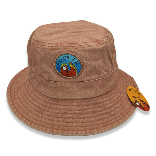 Piraña Joe Originals washed bucket hat in orange – front view with round piranha patch and hang tag