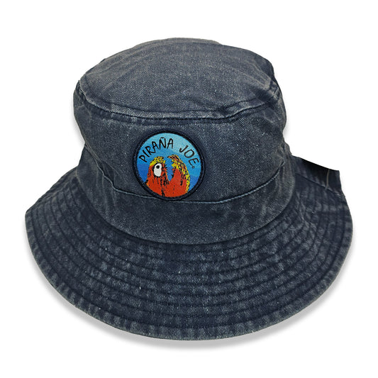 Piraña Joe Originals washed bucket hat in blue – front view with round piranha patch and hang tag