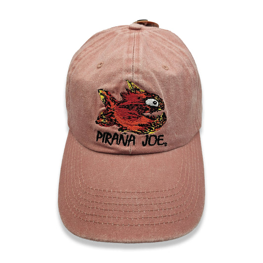 Piraña Joe Originals washed cap in orange – front view with embroidered red piranha and logo